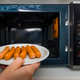 Illustration for article titled Why do sausages scream and explode in the microwave?